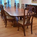 F13. Ethan Allen 18th Century style banded mahogany dining table with 3 leaves, pads and 14 chairs, including 4 armchairs. 29"h x 46"w x72"d 
